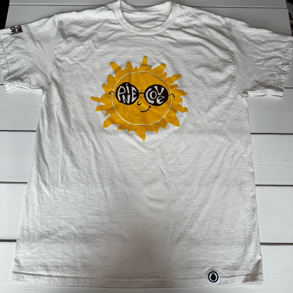 Pine Cove Camp Cream Speckled Unisex Tee with Sun Graphic